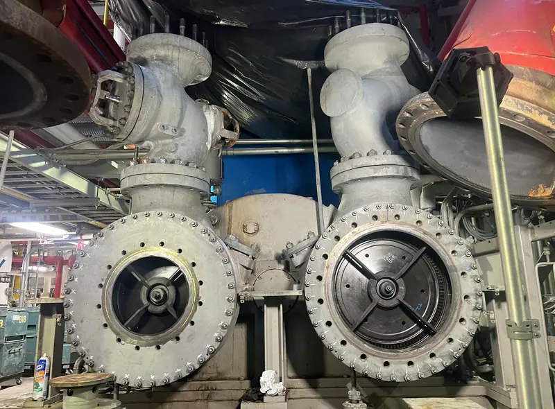 Steam inlet valves and flanged piping on a turbine